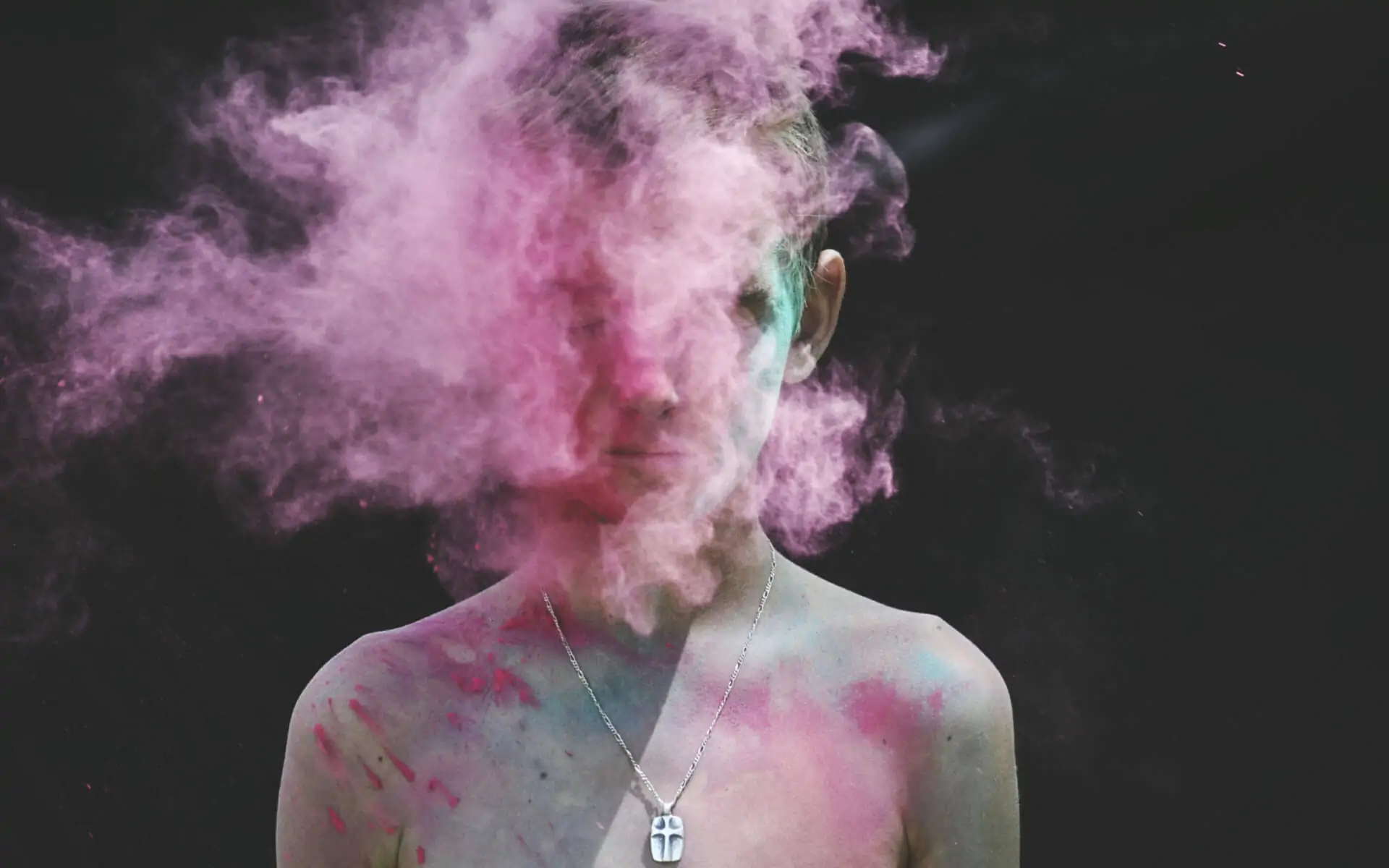 Woman with colored powder on her body and around her head, representing other people's energy