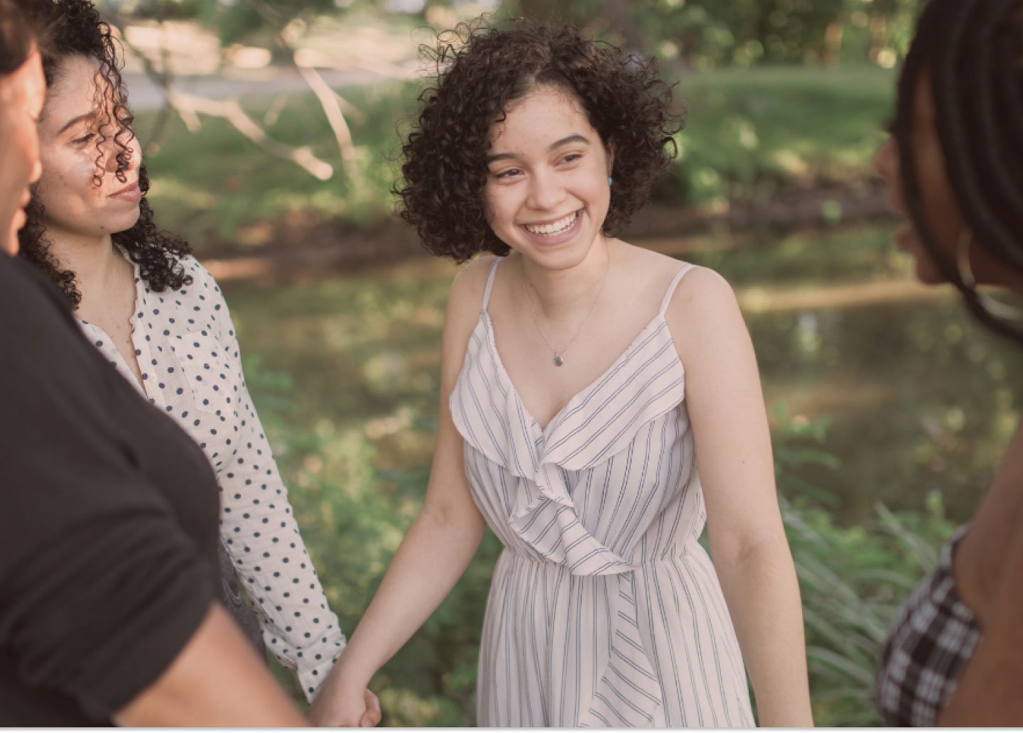 Group of women supporting each other holding hands